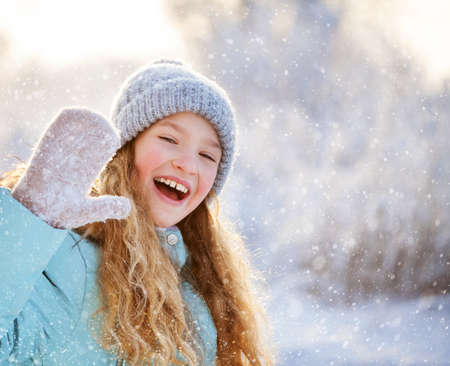 Child at winter. Happy girl outdoors