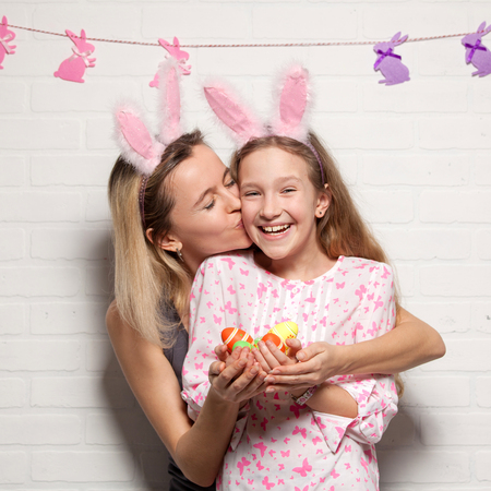 Happy adult woman with with easter eggs