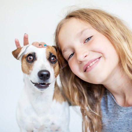 Happy child with dogの写真素材