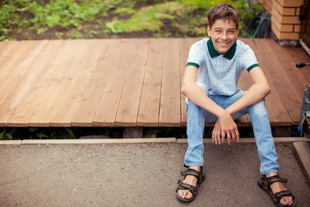 Smiling teen outdoors at summerの写真素材