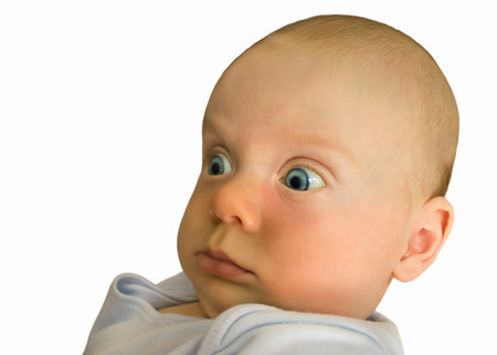 A little baby looks surprised, wide open eyes