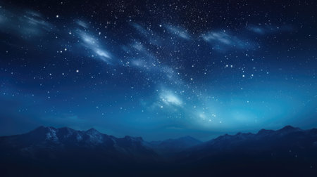 Starry night sky over mountainous landscapeの素材