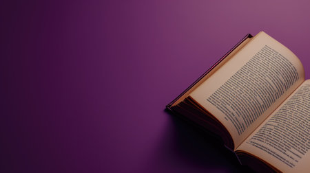 Open book with purple cover on a violet backgroundの素材