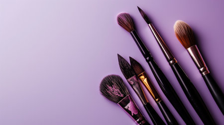Set of paintbrushes on a purple backgroundの素材