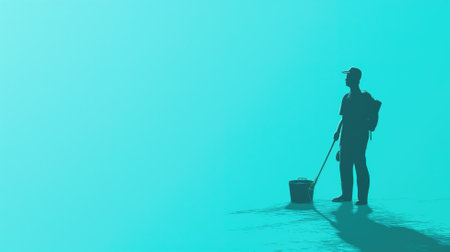 Silhouette of a person cleaning with a minimalist blue backdropの素材
