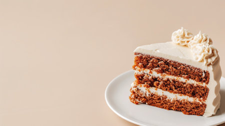 A slice of carrot cake with cream cheese frosting on a white plateの素材
