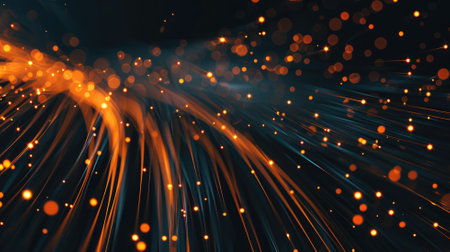 Glowing orange fiber optic cables with light particlesの素材