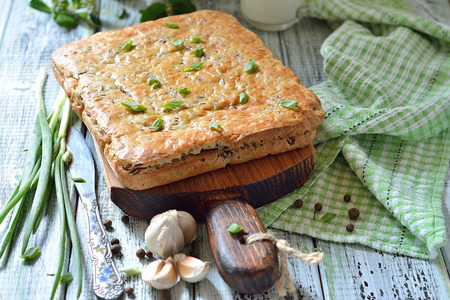 Cake with red rice and meat on the table - tasty still life