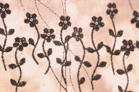 Pattern of stylized wild flowers with stems and leaves on an orange and white mosaic backgroundの写真素材