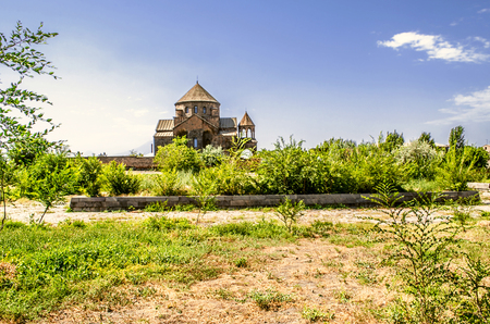 Pathway to the temple great martyr St. Hripsime surrounded by orchardの写真素材