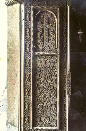 Carved on wood cross on the front door of the Church of St. Hripsime in Echmiadzinの写真素材