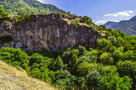 Road leading to the monastery of Haghpat in mountains with medieval caves in the rocksの写真素材