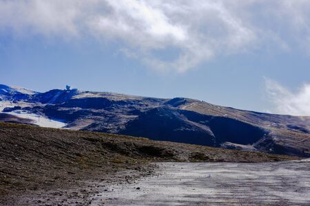 Beautiful landscape snow covered mountains and blue skyの写真素材