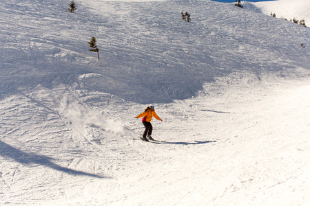 Girl goes skiing in winterの写真素材