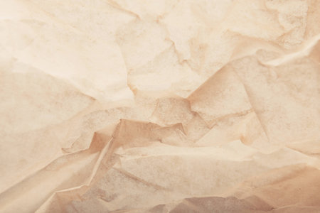 Crumpled baking paper pastel or tracing paper items background for objectsの写真素材