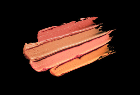 Gradient nude color lipstick smudge isolated on a black isolated backgroundの写真素材