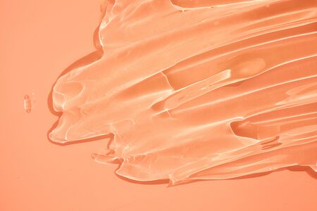 Liquid gel cosmetic smudge orange textureの写真素材