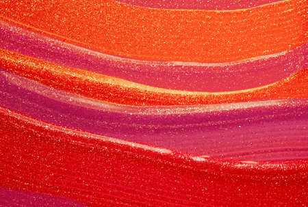 Glossy multi colored lipstick background texture smudgedの写真素材