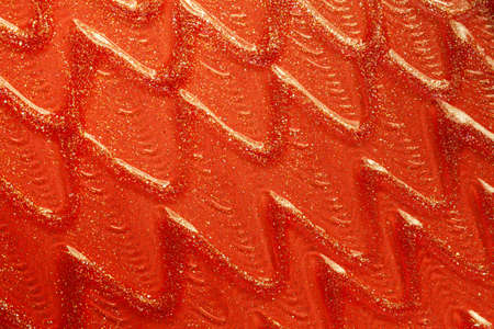 Glossy red orange lipstick background texture smudgedの写真素材