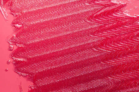 Glossy red lipstick background texture smudgedの写真素材