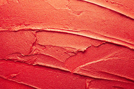 Glossy red lipstick background texture smudgedの写真素材