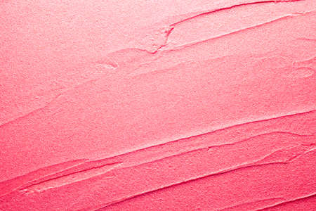 Glossy red lipstick background texture smudgedの写真素材