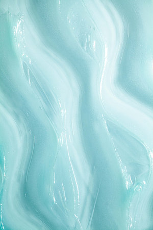 Abstract turquoise background with some smooth lines and spots in itの写真素材