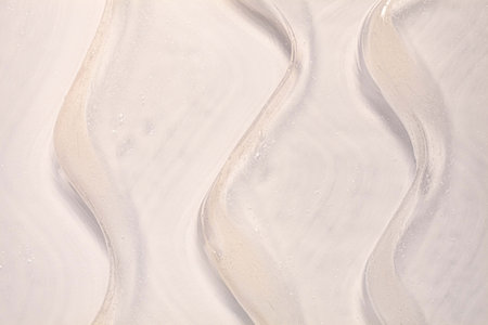 Abstract background of white marble with waves. Texture of natural stone.