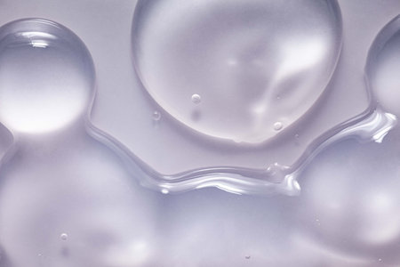 close up of water drops on white background - abstract graphic design and patternの写真素材