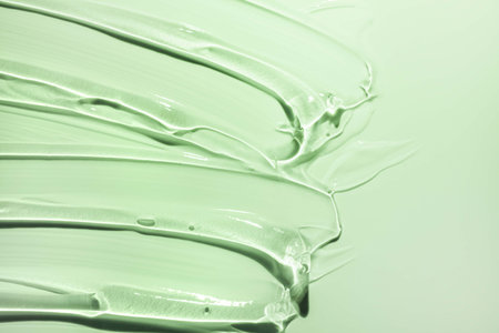 green cosmetic texture background, closeup of cosmetic makeup product on white backgroundの写真素材