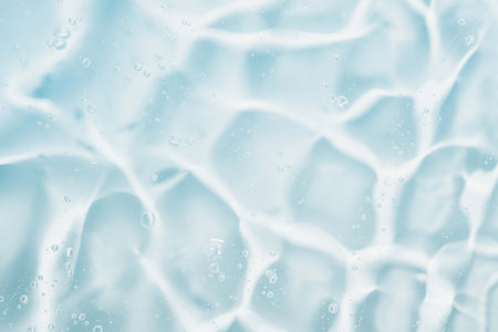 Water surface with bubbles in blue tone. Abstract background and texture for design.の写真素材