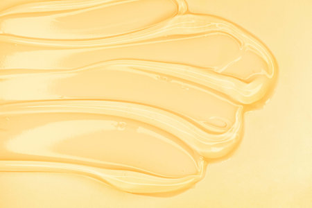 Liquid cosmetic gel or serum texture smudge yellowの写真素材