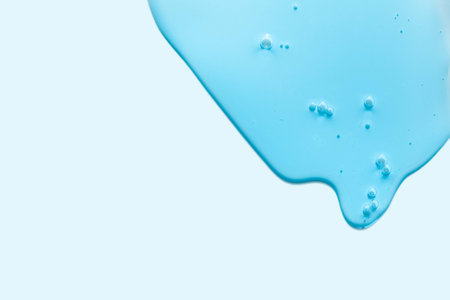 close up of blue drop on white background with copy spaceの写真素材