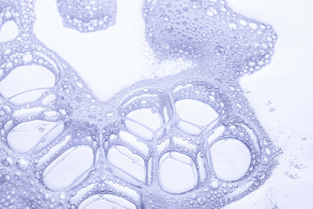 Close up of soap bubbles on white background. Shallow DOF.の写真素材