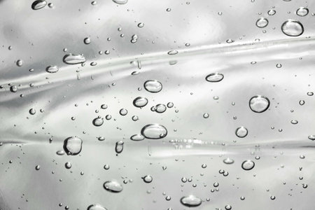 Water drops on the transparent surface. Abstract background.の写真素材