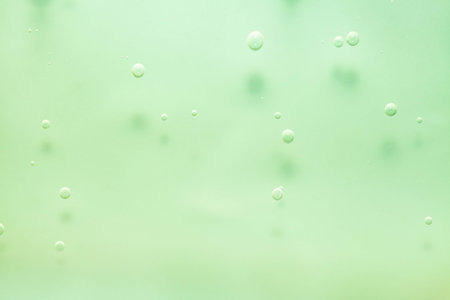 Bubbles of water on a green background. Abstract background.の写真素材