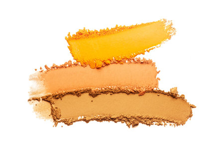 Eye shadow or bronzer yellow orange smudge white isolated backgroundの写真素材