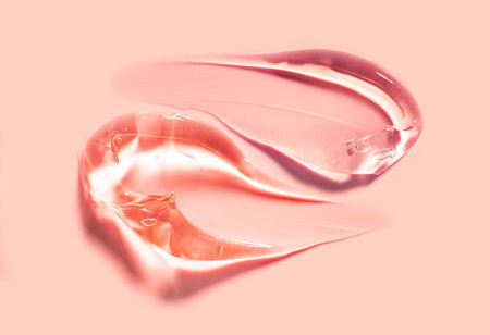 smear paint of cosmetic products on a colored background close-upの写真素材