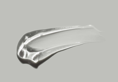 close up of a white liquid on grey background with copy spaceの写真素材
