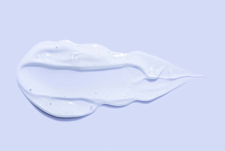 smear of cosmetic products on a white background, closeup of photoの写真素材
