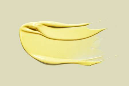 smear paint of cosmetic products on a colored background close-upの写真素材