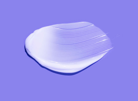 Cosmetic white balm cream texture on purple blueの写真素材
