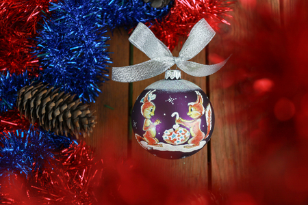 purple christmas ball with squirals on wood table and new year atmosphereの写真素材