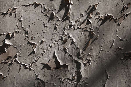 Peeling paint on the wall as an abstract background. Texture.