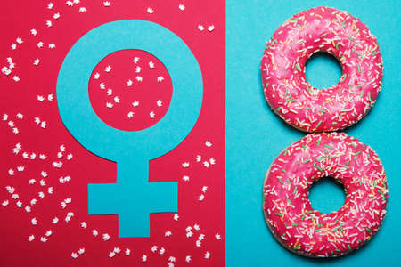 International Women's Day. Postcard for March 8. Flat lay.The gender symbol of Venus. Donuts in the form of number 8.の写真素材