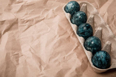 Easter eggs on a craft background. Place for textの写真素材