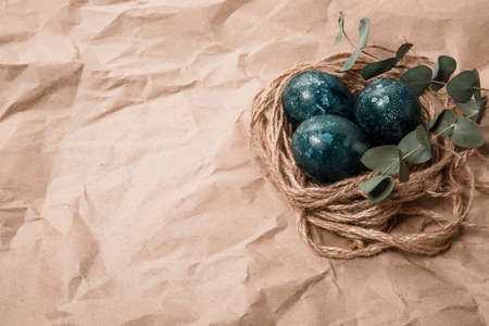 Easter eggs on a craft background. Place for textの写真素材