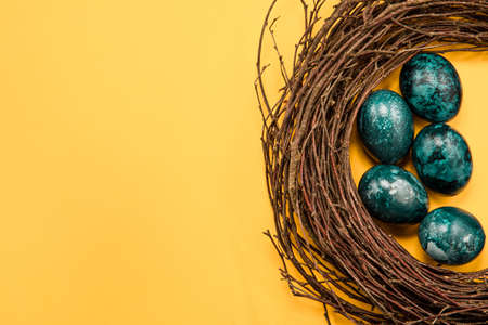 easter eggs on yellow backgroundの写真素材