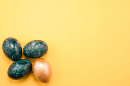 easter eggs on yellow backgroundの写真素材