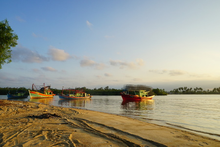 Sunset at Kuala Besut Fisherman village with boatsのeditorial素材